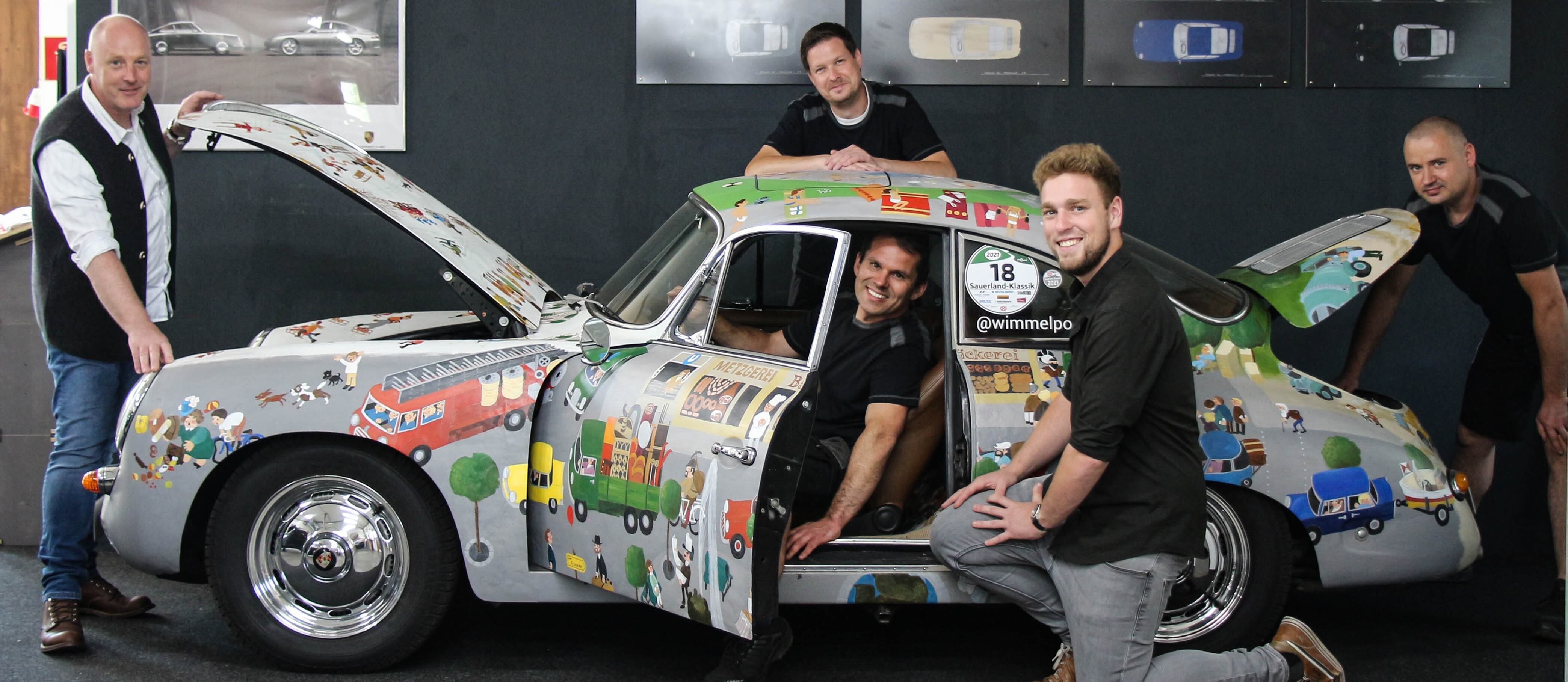 Das MasterTec Team mit dem handbemalten Porsche 356 Wimmelporsche in der Werkstatt